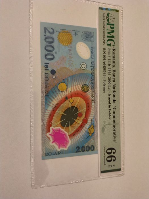 Bancnota de 2000 lei cu eclipsa gradata PMG66