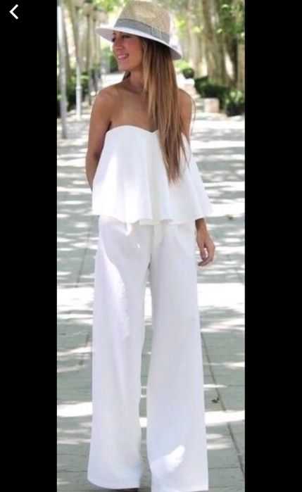 Pantalon salopeta evazata alba material elastic.