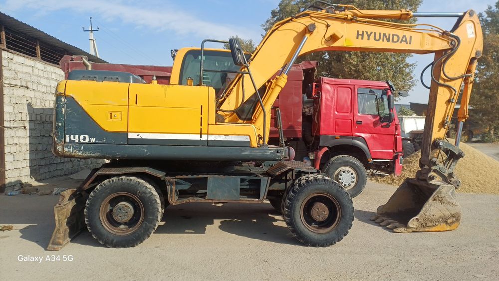 Экскаватор хизмати