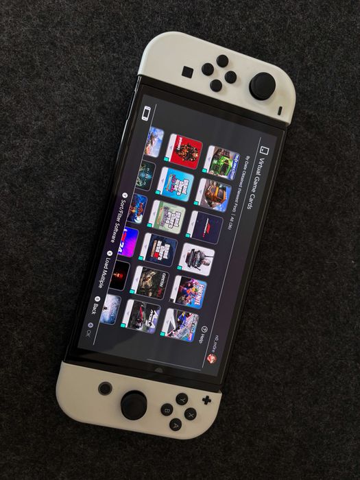 Nintendo Switch OLED - White + 30 дигитални игри и подарък волан