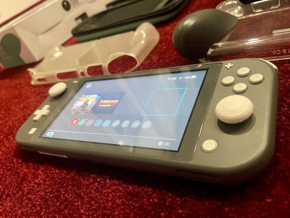 Nintendo Switch lite + accesorii impecabil