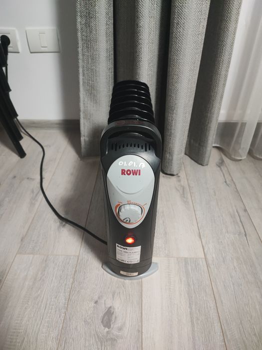Calorifer electric pe ulei ROWI 1000W ca si nou, perfect functional