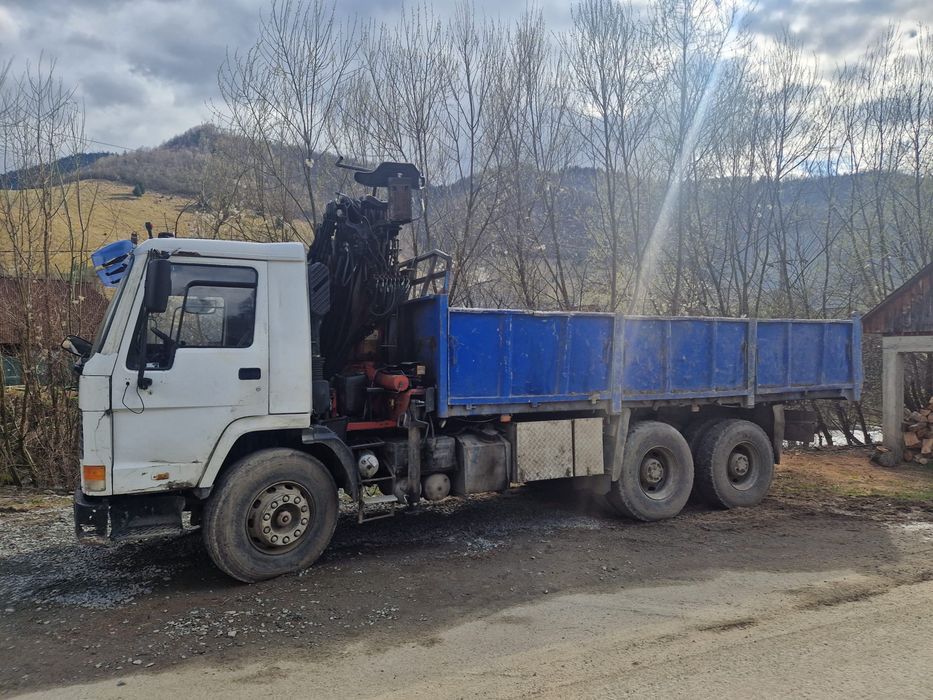Volvo FL12 basculabil 6x4 cu macara si racoante forestiere