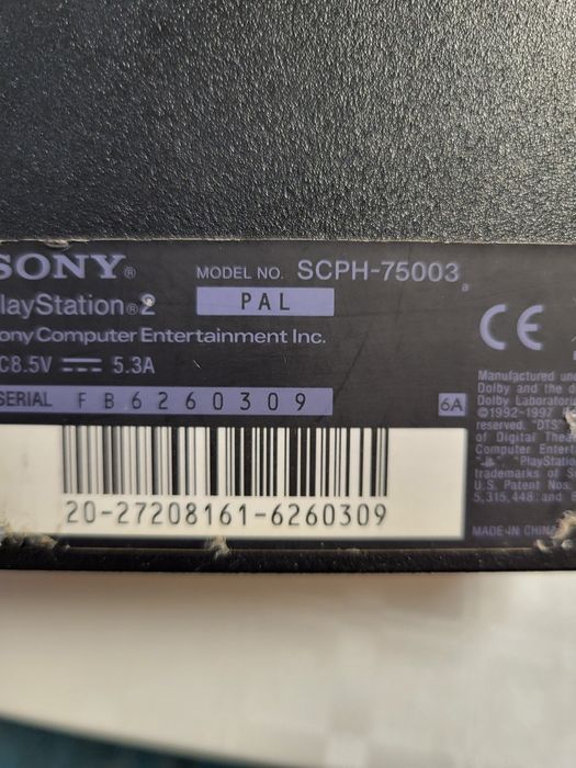 PlayStation 2 Slim  in cutie cu 4 jocuri.