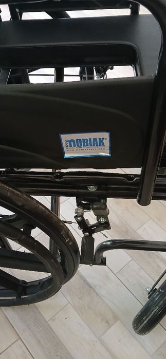 Scaun cu rotile în stare  noua