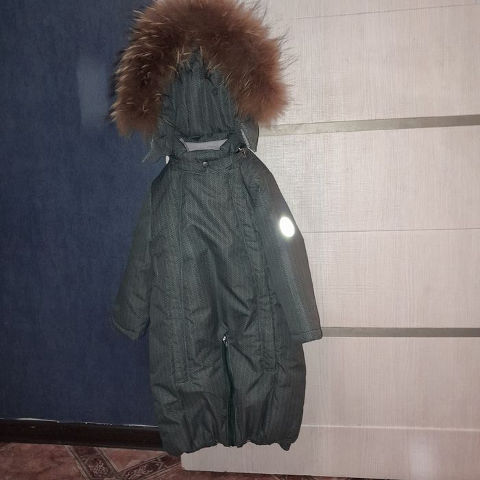 Продам б.у зимней  комбинезон- мешок .