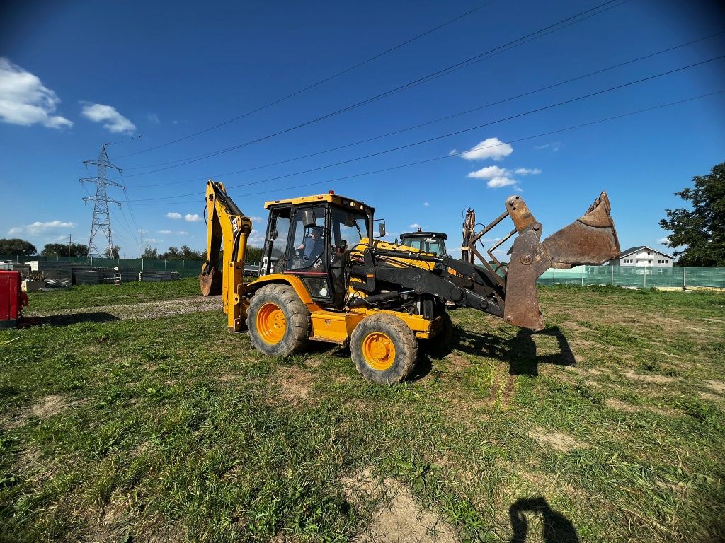 Vând Buldoexcavator CAT 428 C 2001