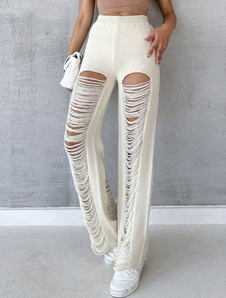 Pantaloni albi de plaja rupti