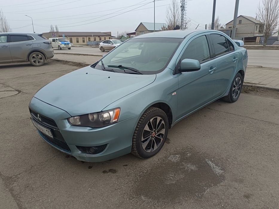 Митсубиси Лансер Х