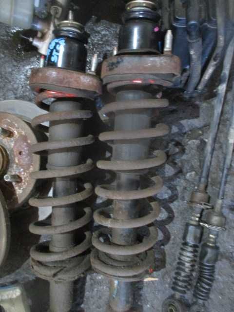 Amortizoare arcuri flanse spate MITSUBISHI LANCER an 2006 originale