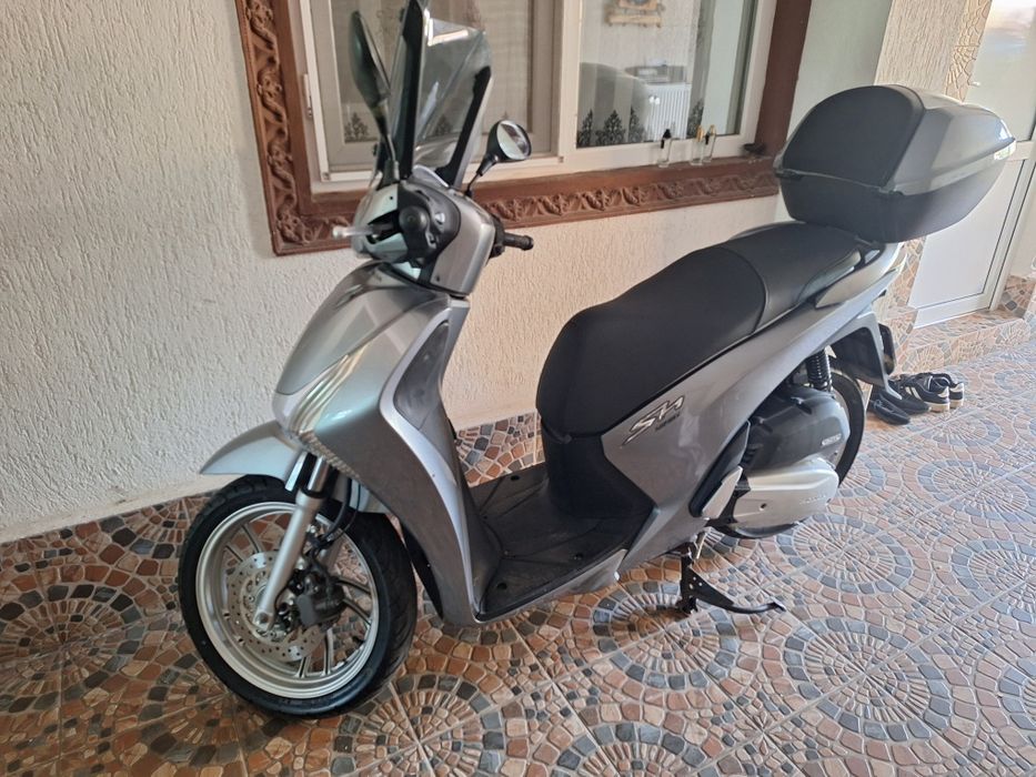 Vand sau schimb cu ATV..Honda sh 125i an fabricație 2016 km 7000