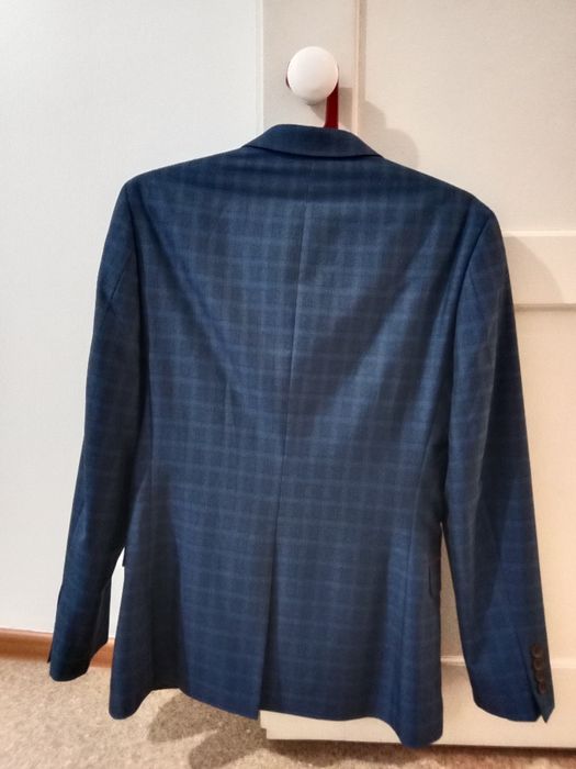 Продам новый мужской костюм с брюками синего цвета  48-50 размера
