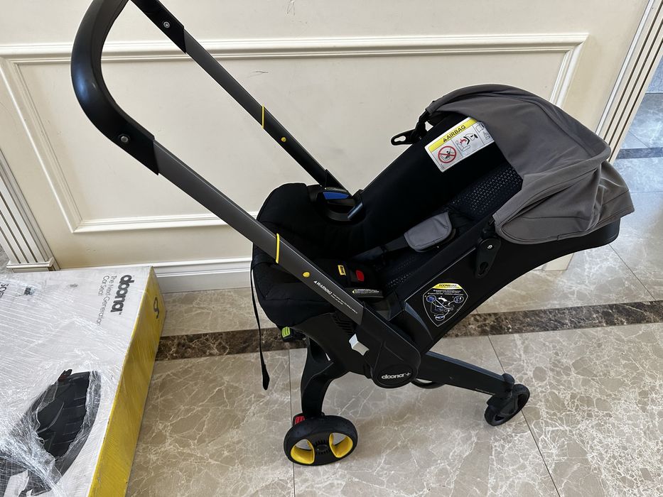 Коляска Doona + база isofix doona