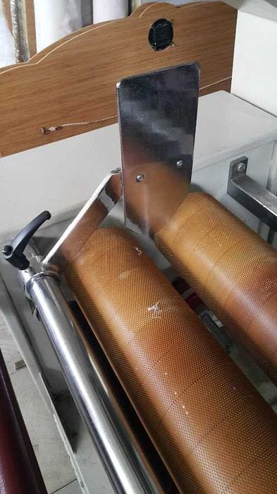 Машина за навиване, измерване и окачествяване на плат на ролки