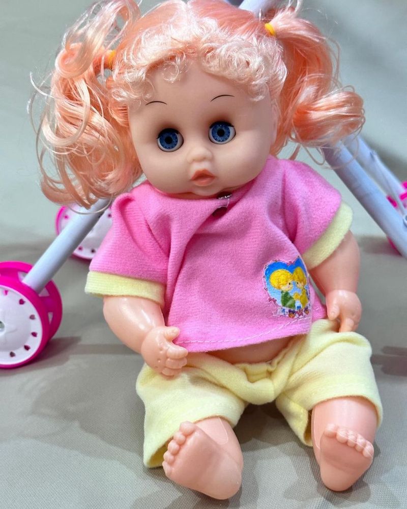 Детская игрушка «кукла в коляске»