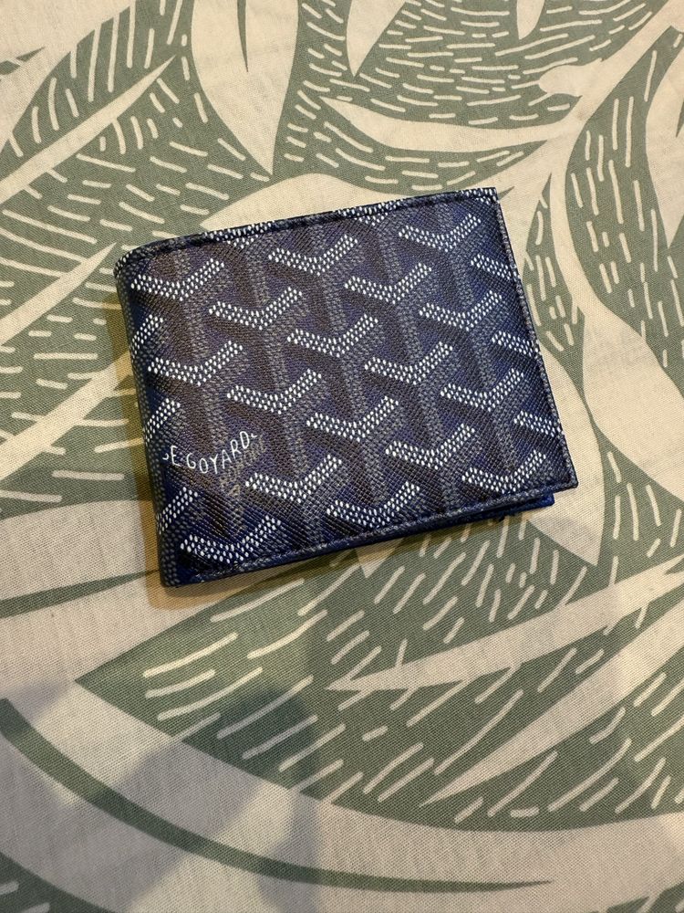 Портфейли Goyard и Gucci