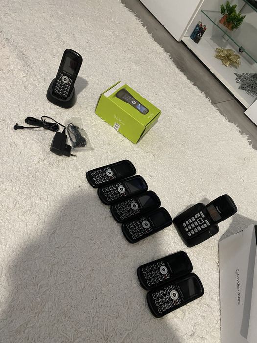 Telefon fix cu stand pentru incarcare si casti .noi noute