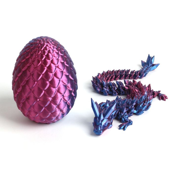 Детская игрушка дракон в яйце