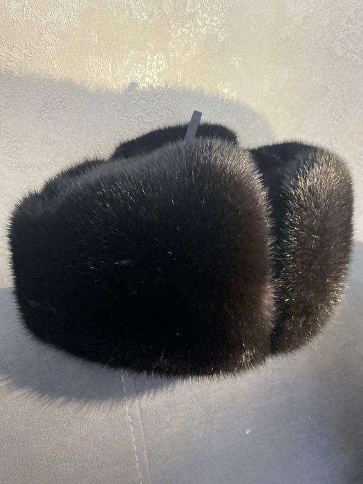 Продам норкавую шапку ушанку алмазно чёрного цвета в отличном состояни