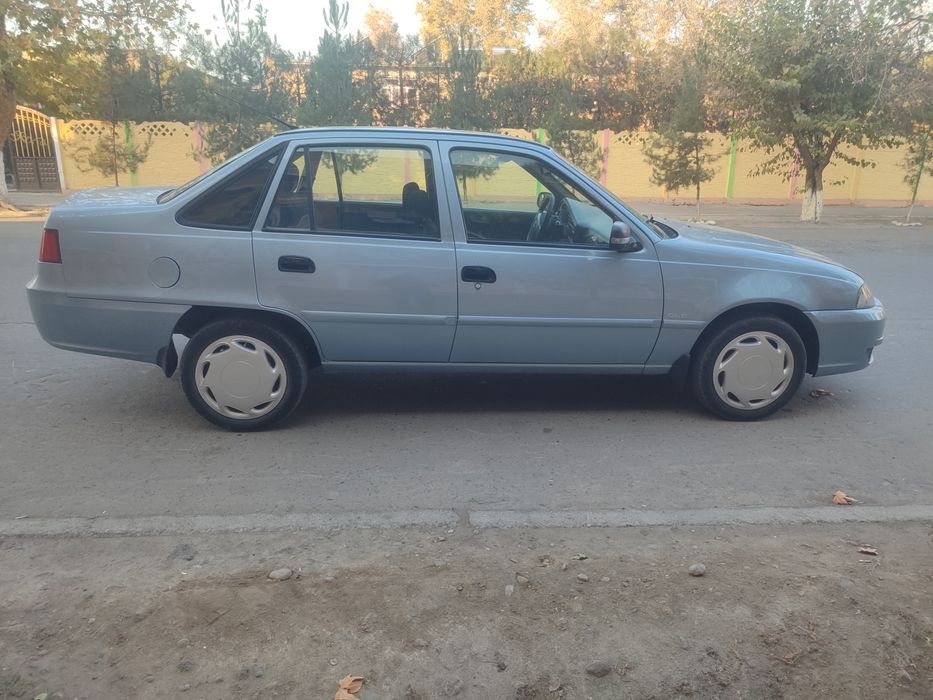 Нексия 2  Сонс гибрит матор лукс-кандисанер 2014 йил 320минг юргани  к