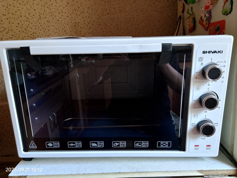 Продам электрическую мини печь . Shivaki 3614 .