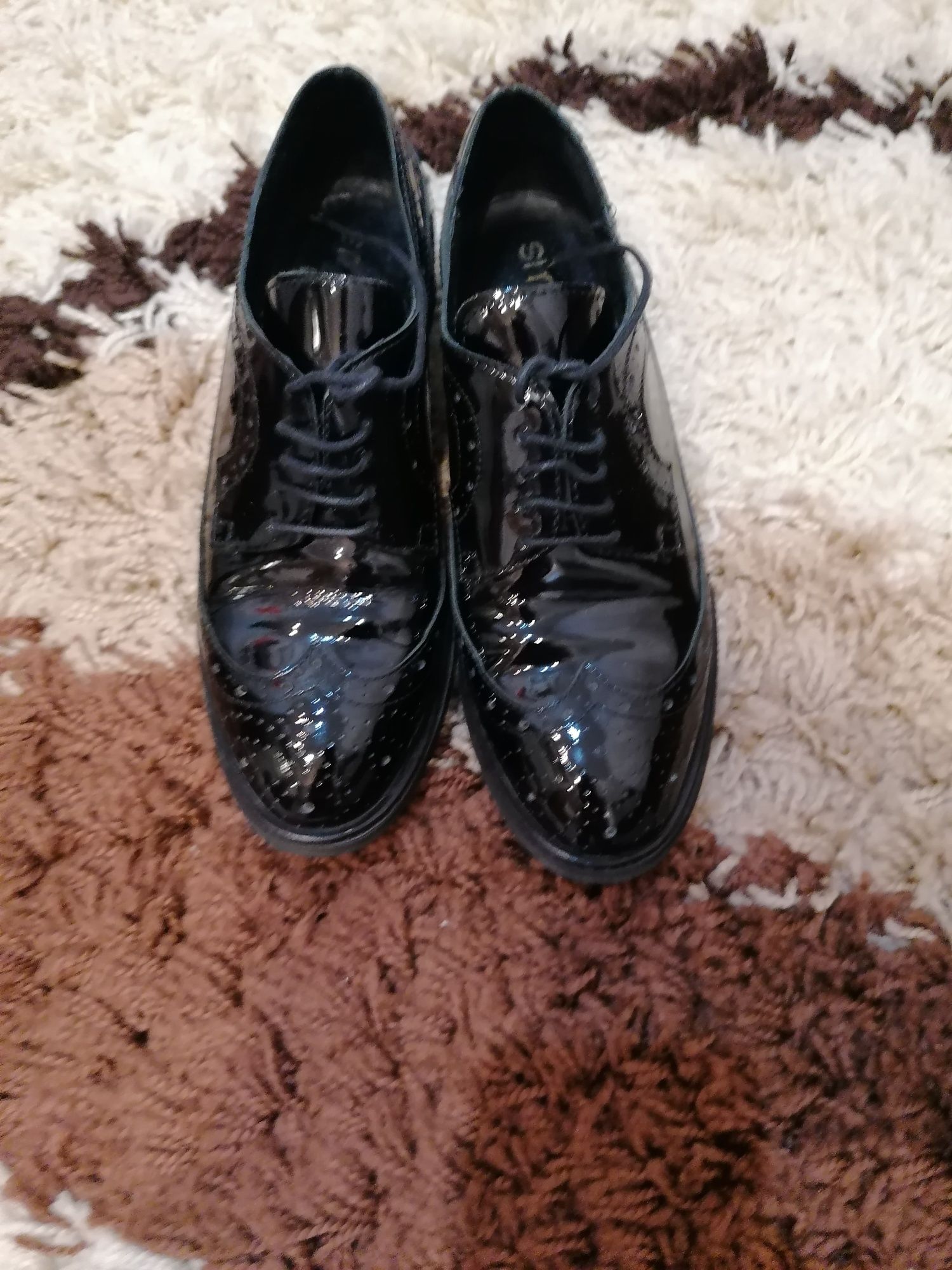 Pantofi Oxford di piele