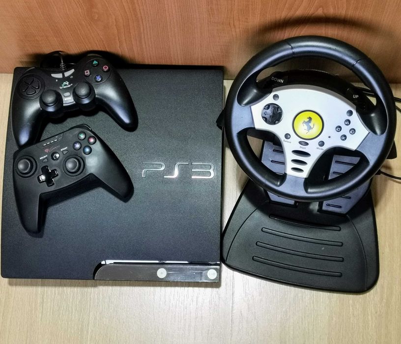 PS3 cu volan si pedale + 50 jocuri + 2 manete. Raspund doar telefonic.