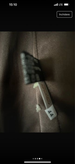 Vesta blana ,cu gluga foarte frumoasa . Cumparata din grecia