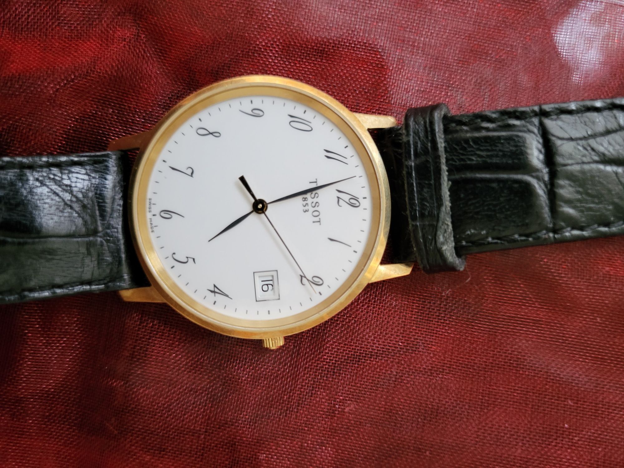 часы золотые Tissot