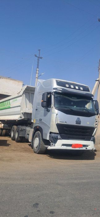 HOWO A-7  тягач ва прицеп тезда ва арзон нархда сотилади