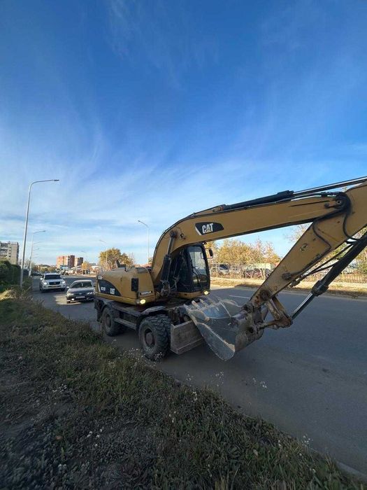 Услуги колесного экскаватора Сат М318D. Объём ковша 1.2 м3,