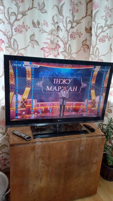 Телевизор LG ұсталған