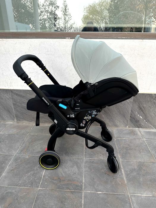 Автокресло и детская коляска Doona