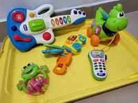 Игрушки Chicco и Fisher Price в контейнере.