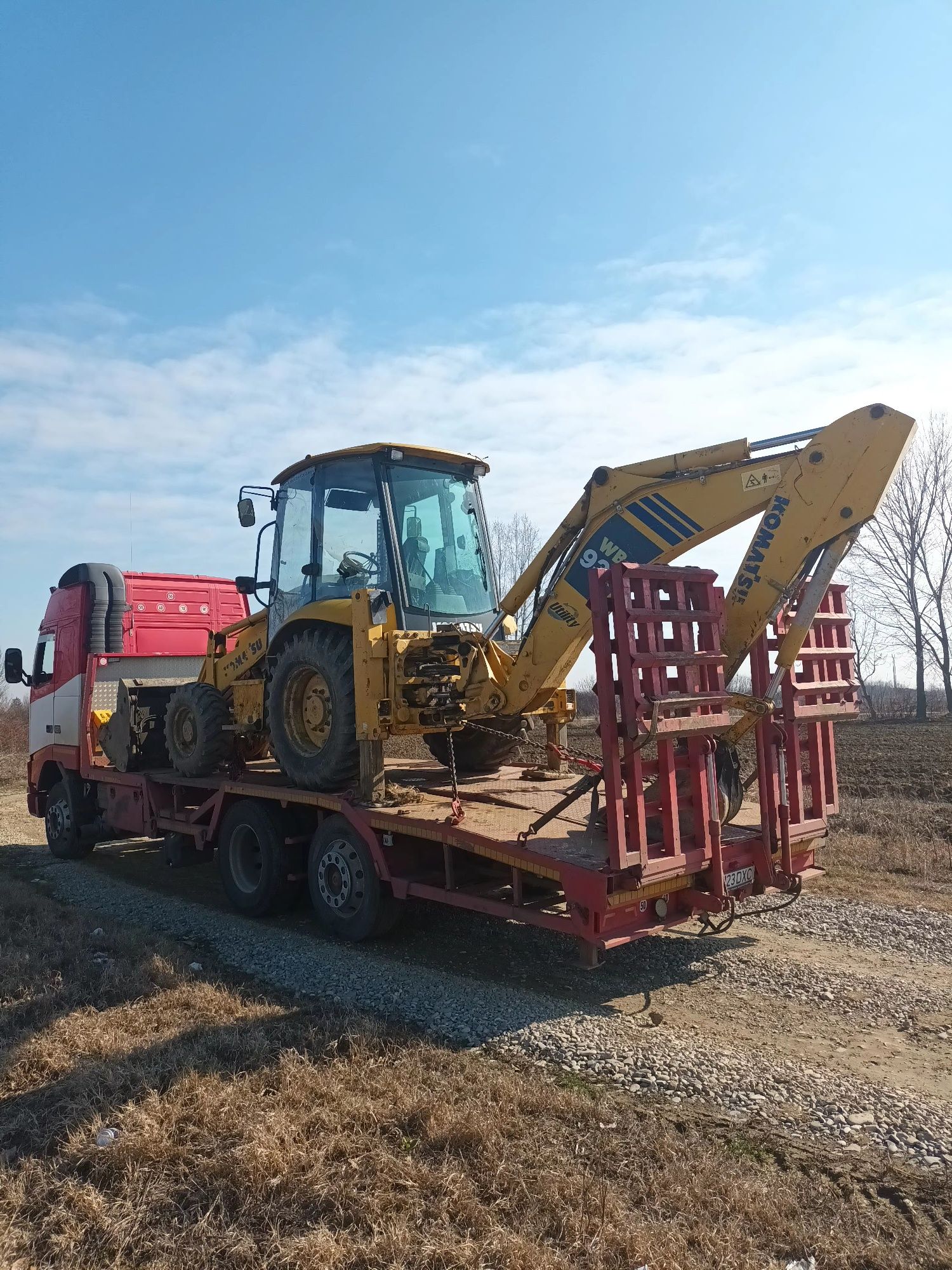 Transport buldoexcavator