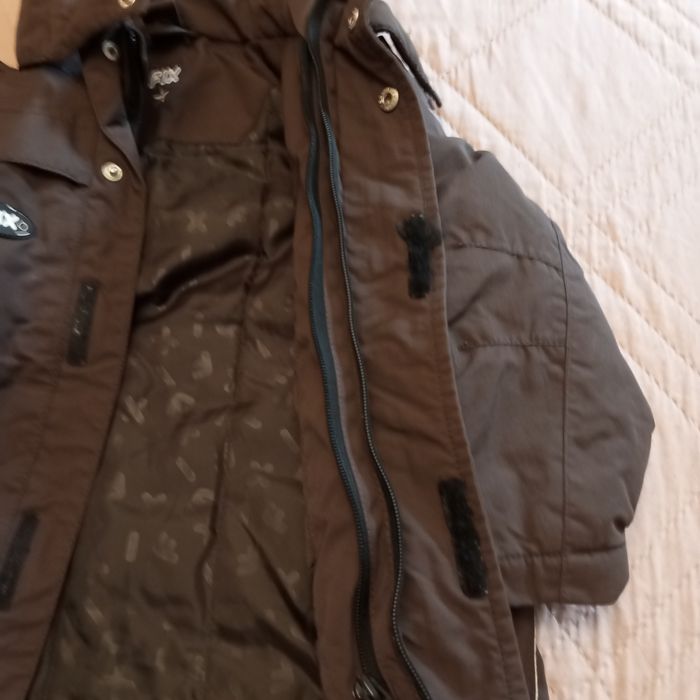 Детско яке дължината се вижда на рулетката.