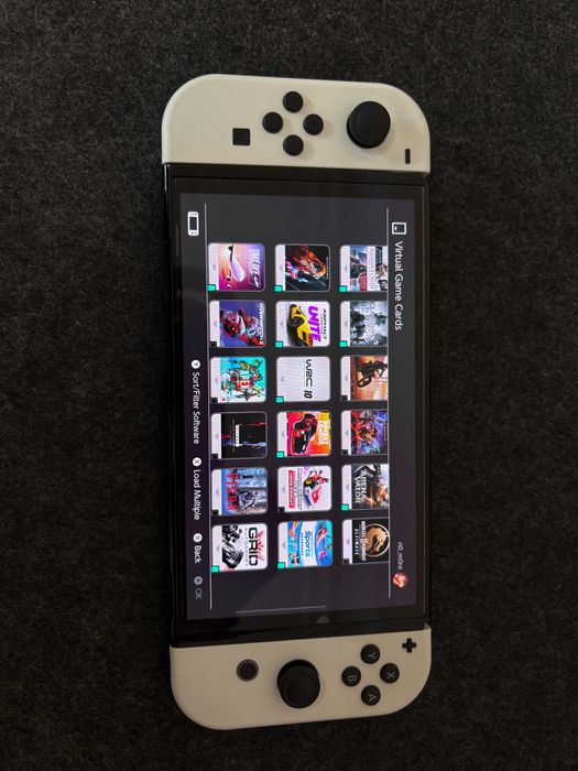 Nintendo Switch OLED - White + 30 дигитални игри и подарък волан