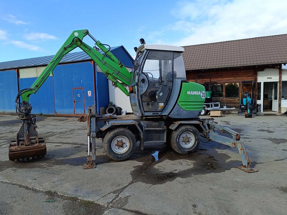 Excavator pe roți HANSA APZ 531 – 2003 – graifer hidraulic rotativ