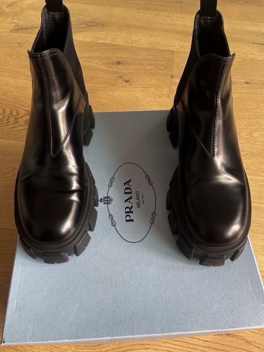 PRADA
Monolith leather ankle boots