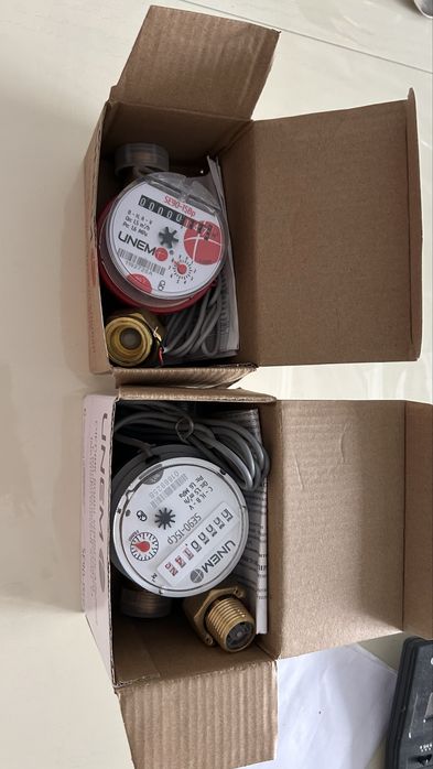 счетчики для воды новые ,комплект (холодной и горячей)