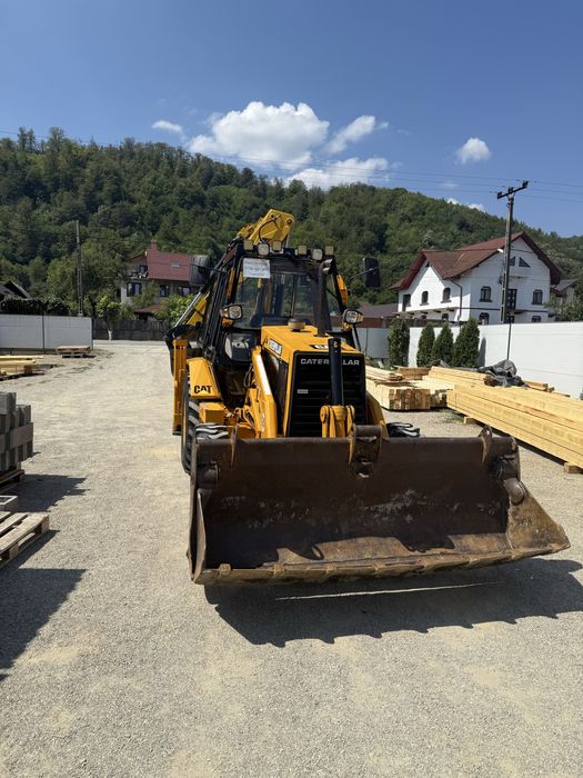 Buldoexcavator Caterpillar 428B 4x4 cu blocanti si 3 cupe