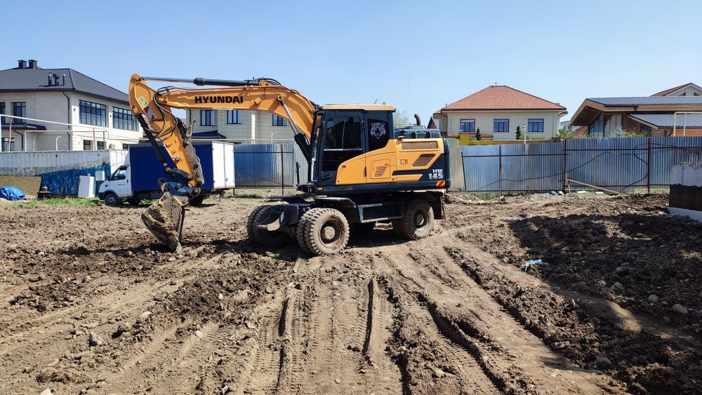 Услуга экскаваторов. Аренда колёсного экскаватора, гидромолот.