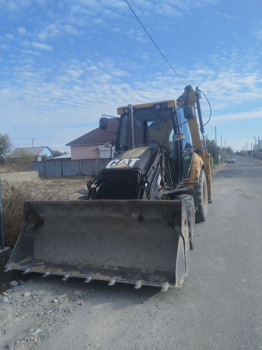 Продам экскаватор погрузчик 3/1 cat 432E