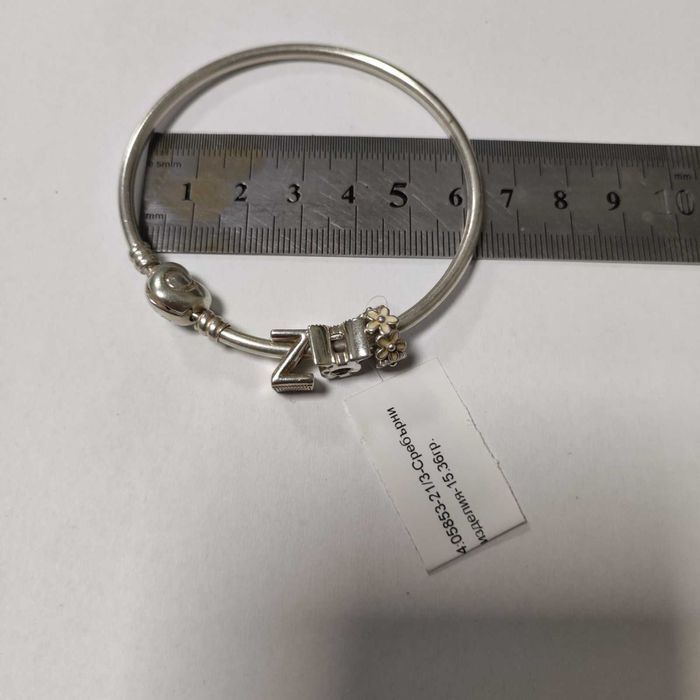 Сребърна гривна Pandora с три талисмана 15.36гр.