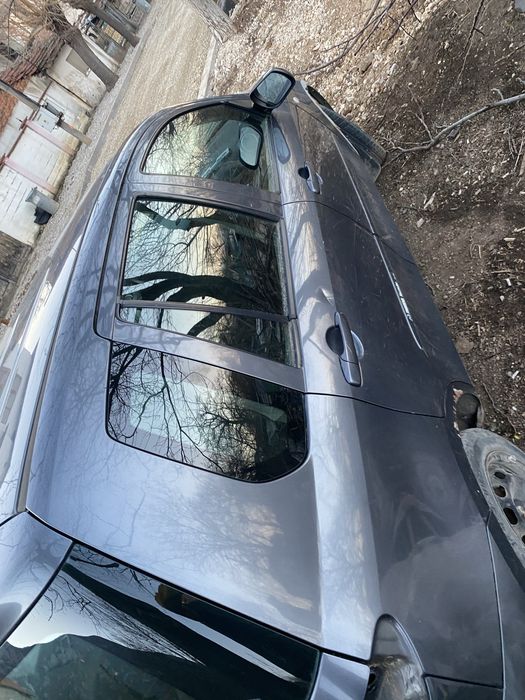 Мазда 2 на части