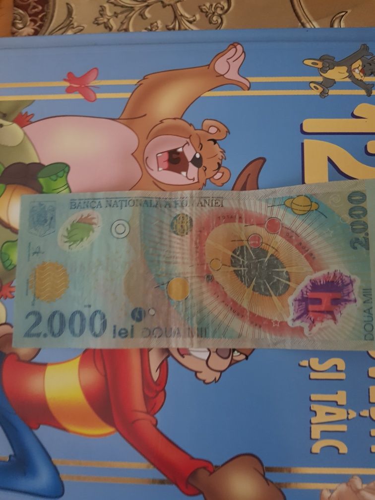 Bancnotă 2000 de lei anul 1999 seria 004E *NEGOCIABIL*
