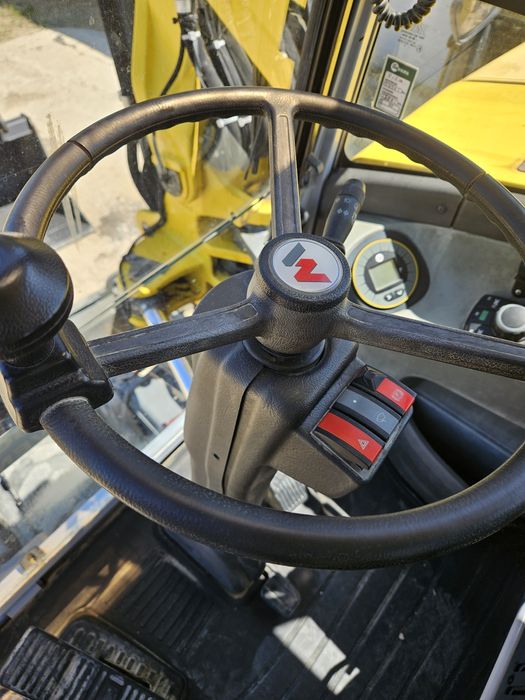 Excavator pe roti Neuson rototilt