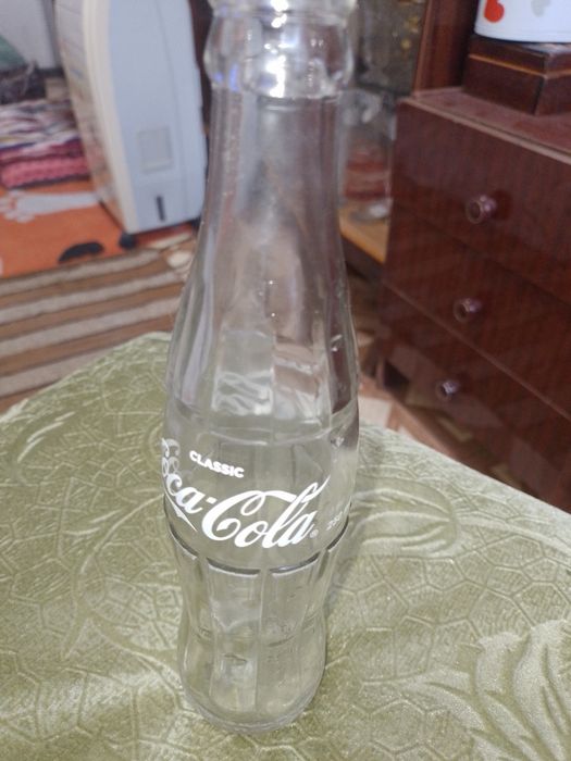 Стеклянные бутылки "Coca Cola".