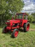 Tractor U650 + remorcă + piese de rezervă – pachet complet, stare bună