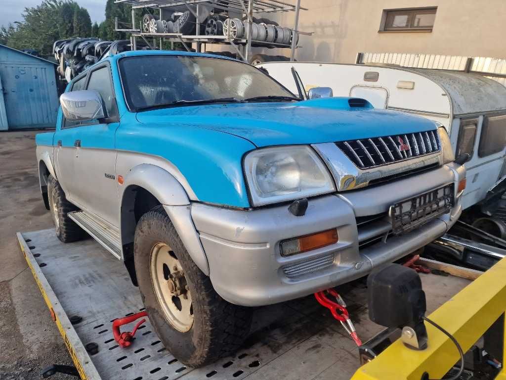 Dezmembrez Mitsubishi L200 2.4 benzina cod 4G64 97 KW an 2001